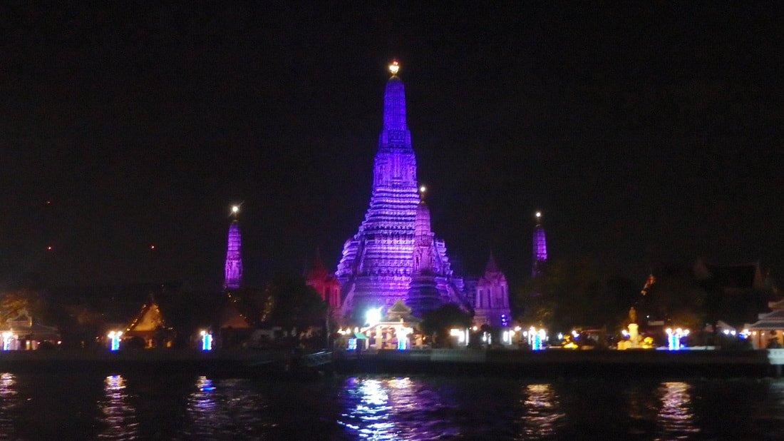 A temple lit up with purple lights