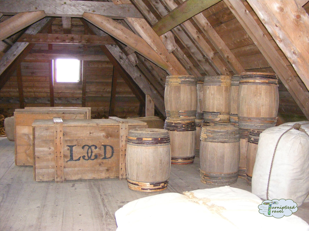 Wooden barrels and boxes in a storage room