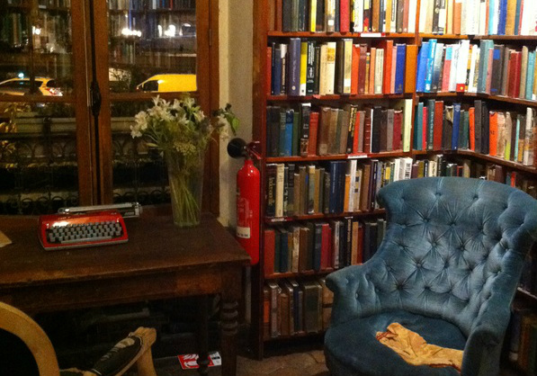 Blue armschair in a corner of Shakespeare and Company at night Picture