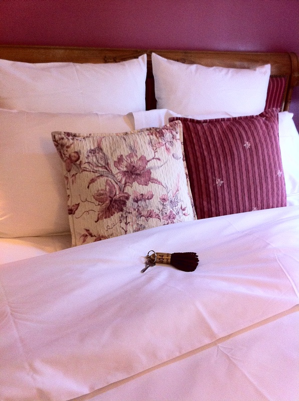 Close up of key and bed linens Hotel Academie Paris TuripseedTravel.com