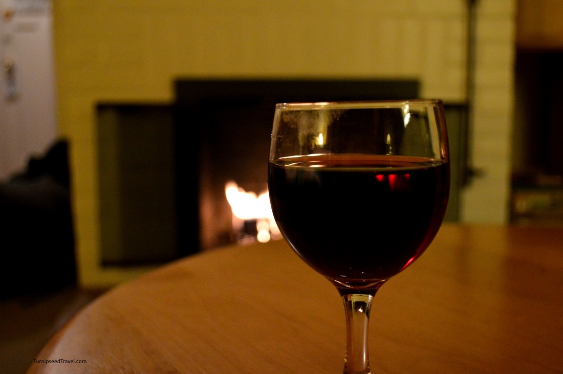 Vacation wine by the fireside money saving tips