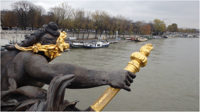 Visiting Paris for the first time - golden statue on bridge