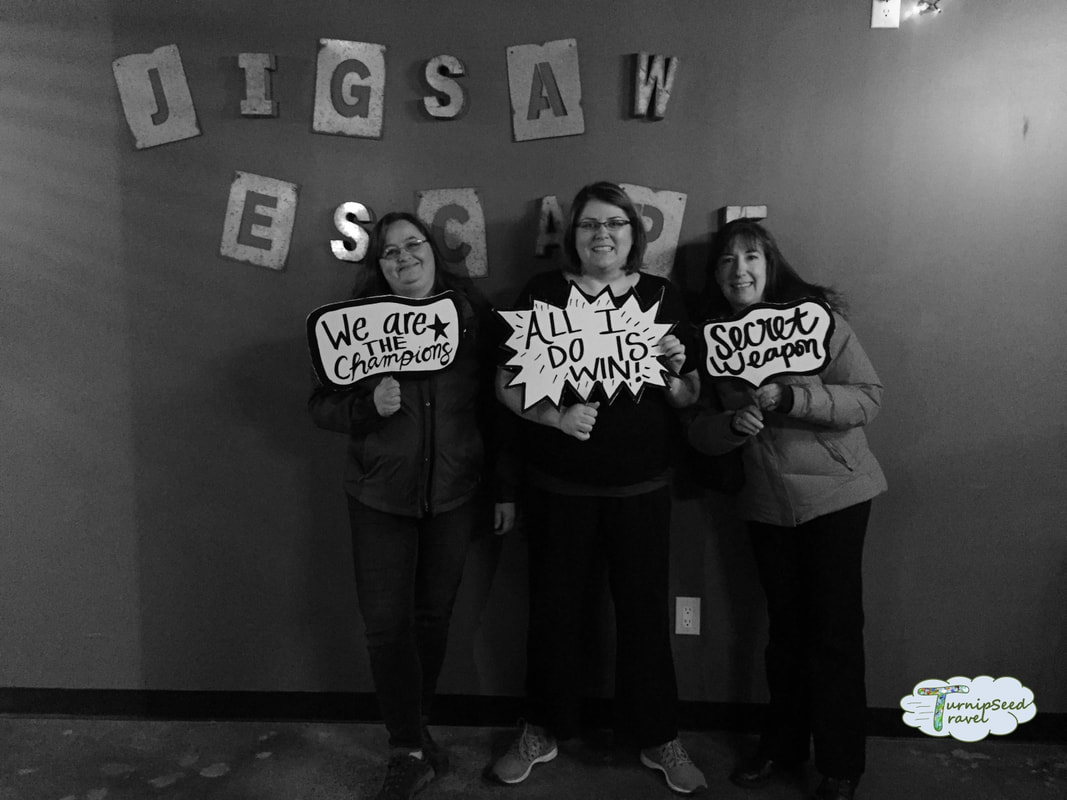Black and white photo of friends at Escape Room Cozy microadventures for Ottawa travellers by TurnipseedTravel.com
