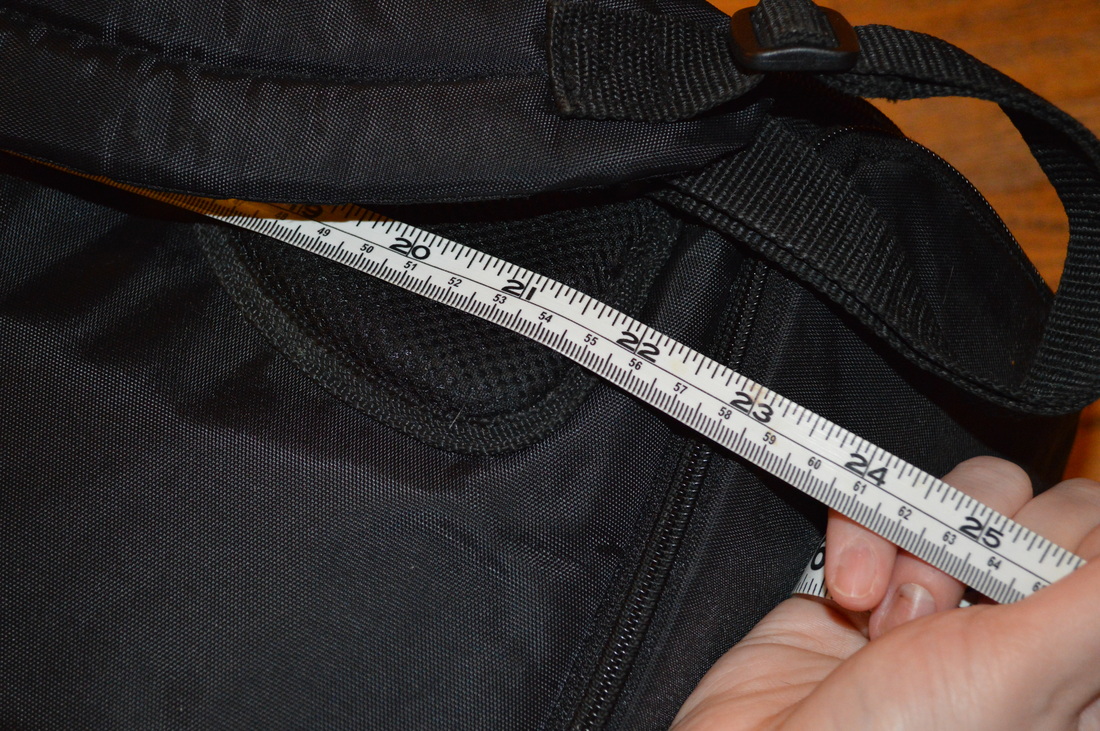 Image of a black backpack and measuring tapePicture