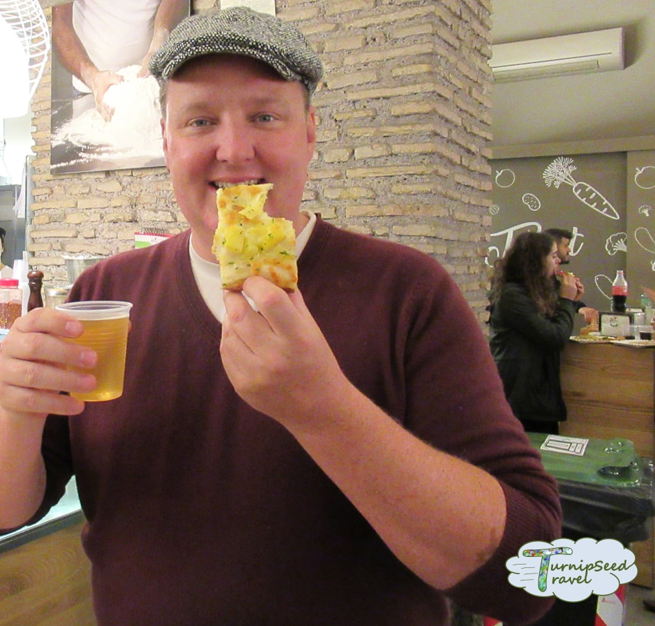 Inside Rome's yummiest food tour! Sampling potato pizza.