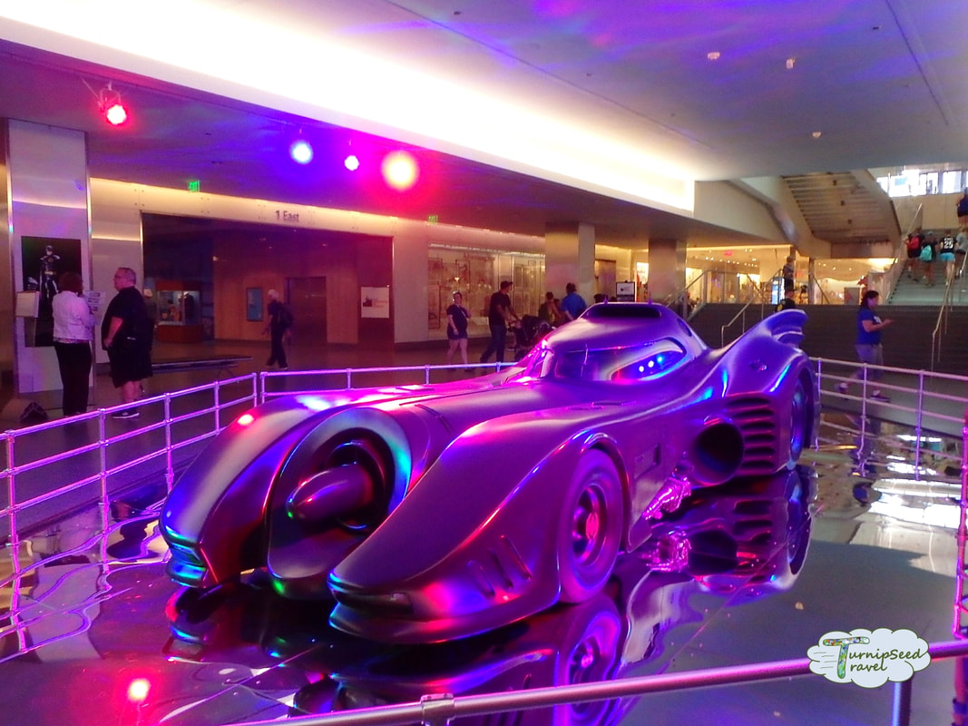 Batmobile car illuminated by purple lights at the Smithsonian museum Picture