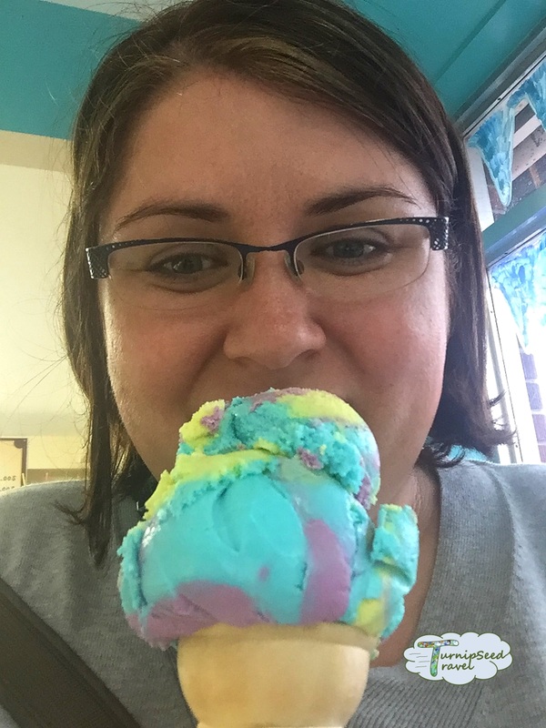 Vanessa eat a colourful ice cream cone