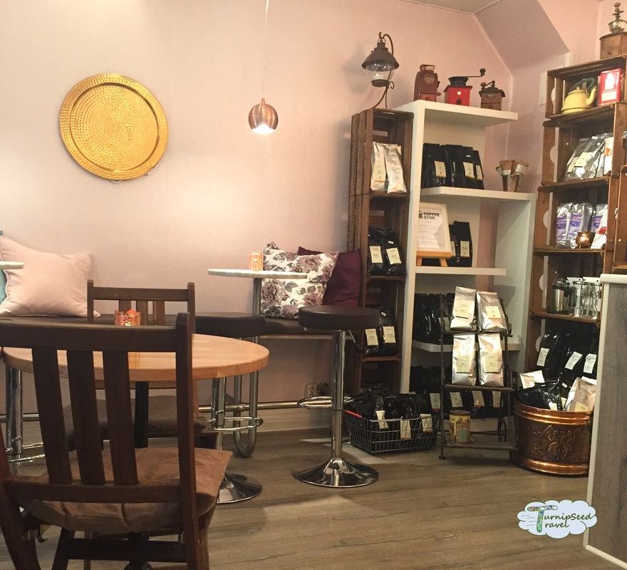 Cute cafe interior and bags of coffee beans for sale