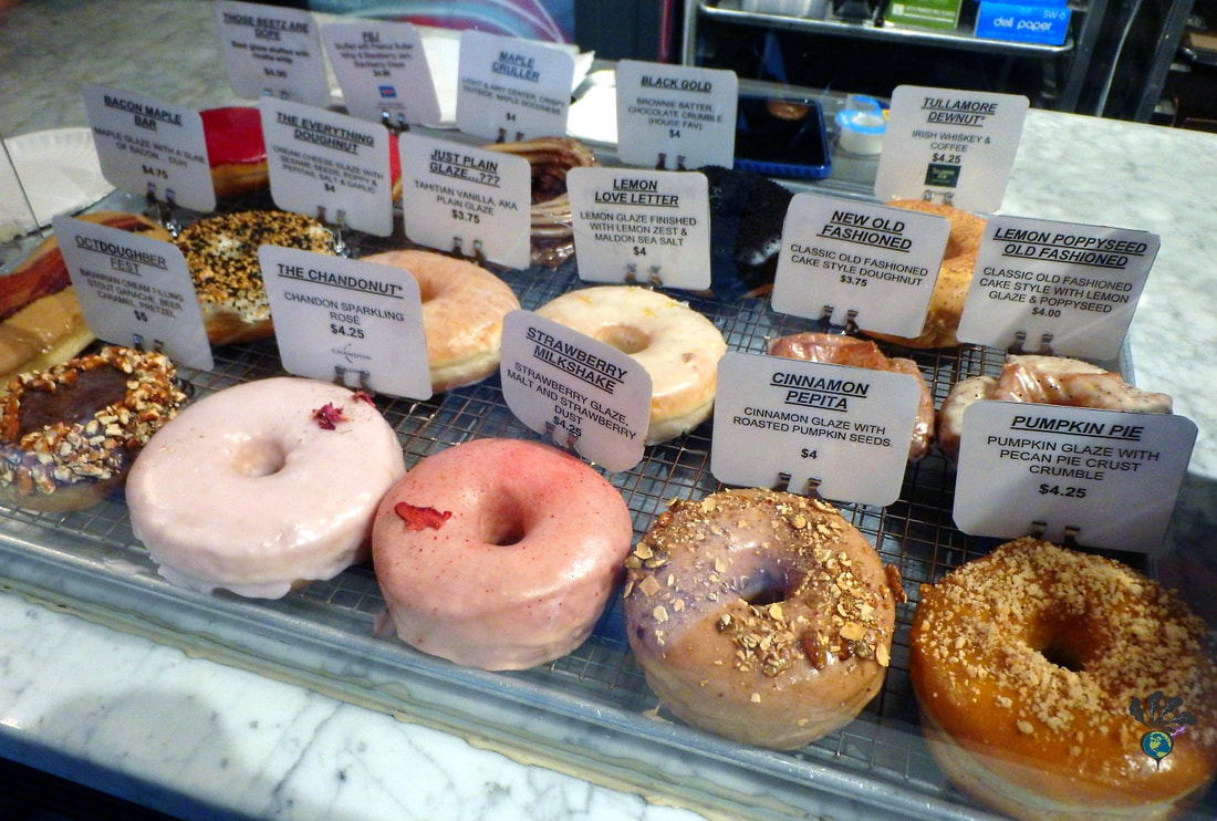 Greenwich Village Food Tour New York: Display of colorful donuts in different varieties 