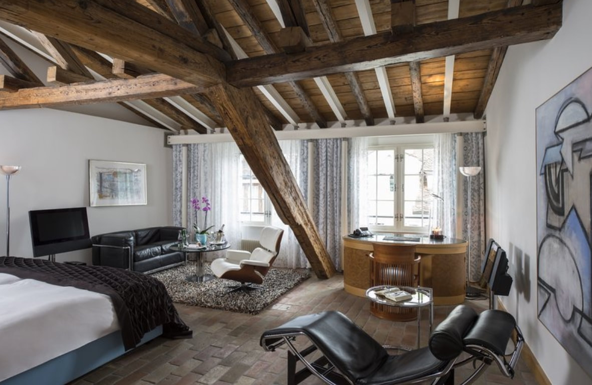 Where to stay in Zurich Deluxe room at Widder Hotel with wooden ceiling beams 