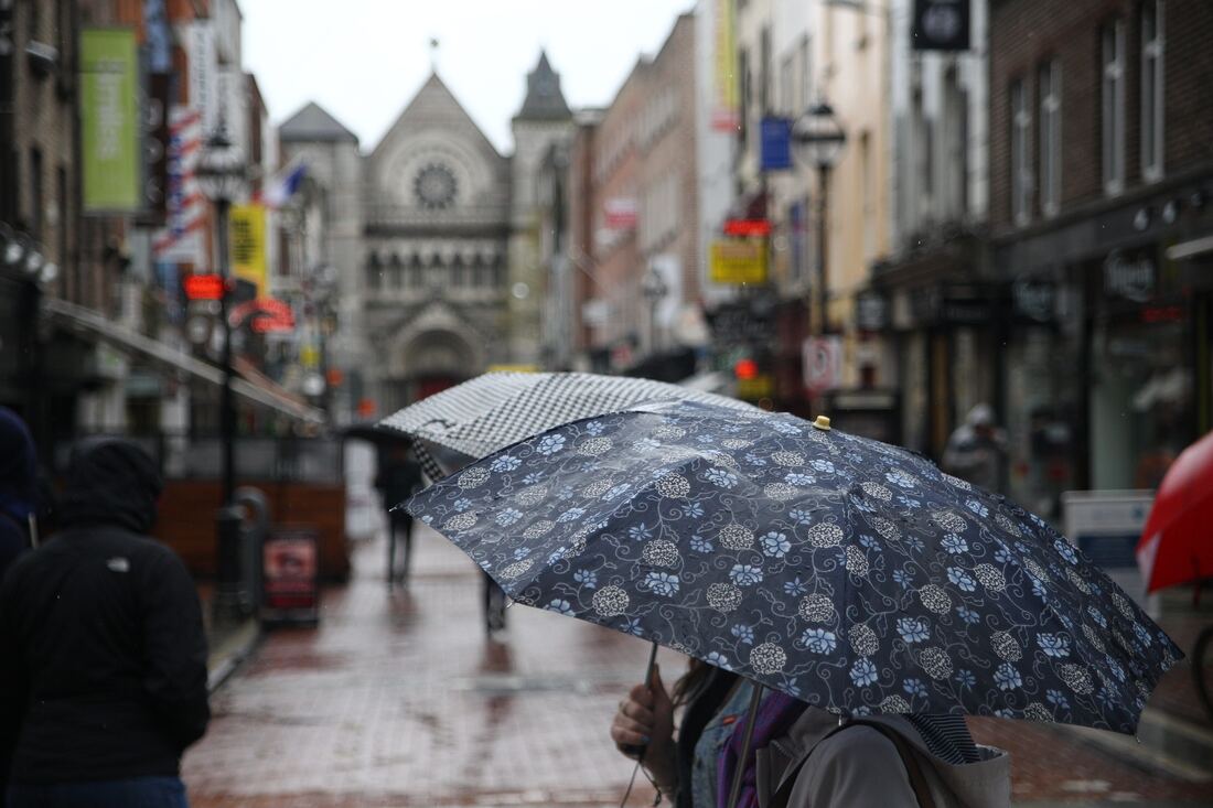 Exploring Dublin's Cozy side by TurnipseedTravel Umbrella in the rain