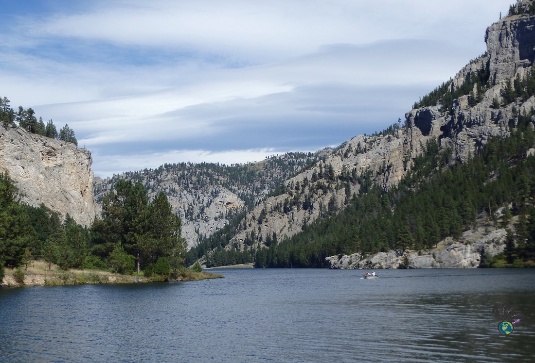 Limestone cliffs, trees, and blue water at Gates of the Mountains wilderness area Picture