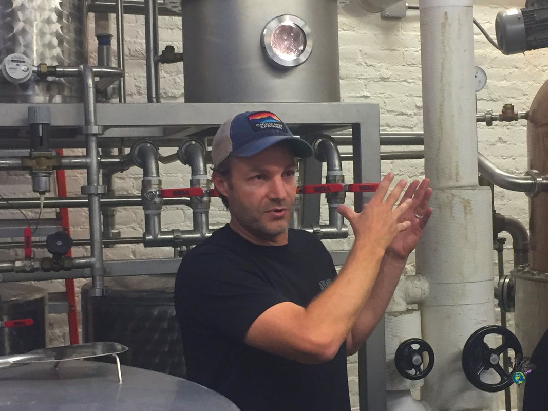 Owner Ryan describes the equipment at Montgomery Distillery in Missoula Montana Picture