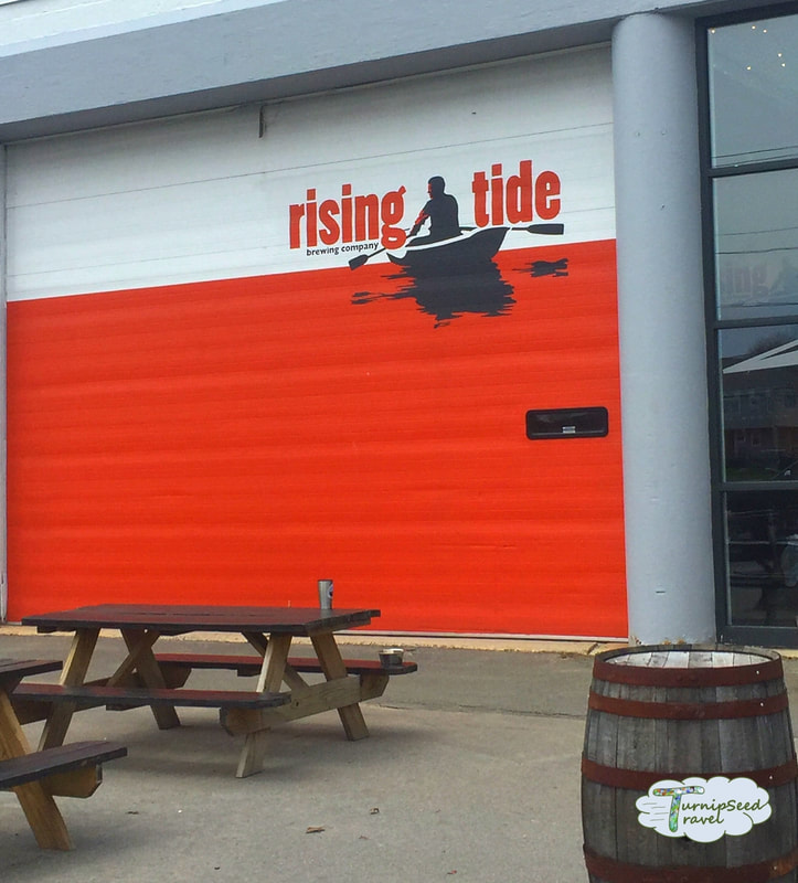 Orange front doors of Rising Tide Brewery Portland Maine re