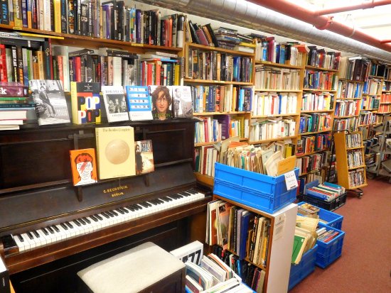 Piano in the cramped music section of Skoob Books Picture