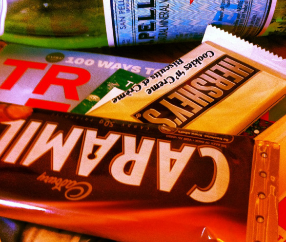 Close up of chocolate bars and magazines Picture