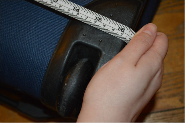 Carry On Limit - suitcase being measured