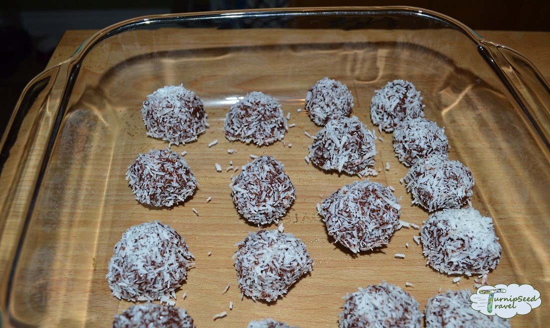Coconut covered candies in a glass dish