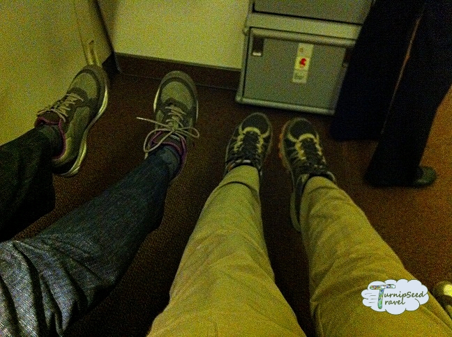 Stretching our legs in an airplane exit row Picture