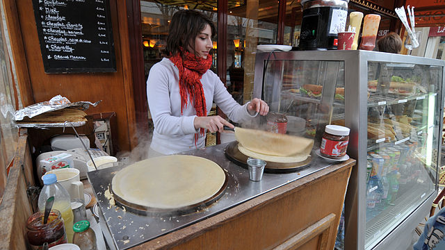 Woman in a white shirt works at a crepe stand Picture
