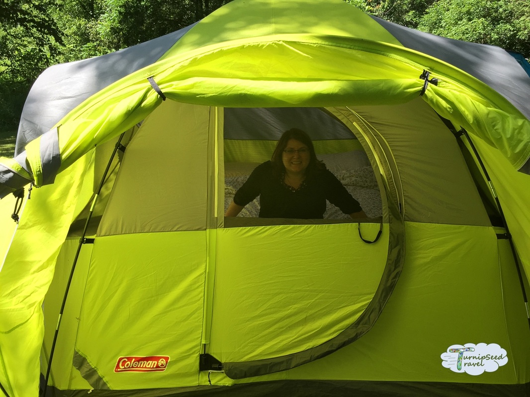 Pittock Conservation Area camping Tent - Vanessa looks out of the green tent 