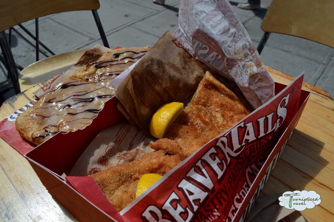 Beavertails pastry with lemon wedge 