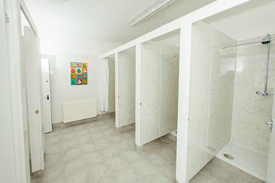 Photo of a generic white dorm style shower room Picture