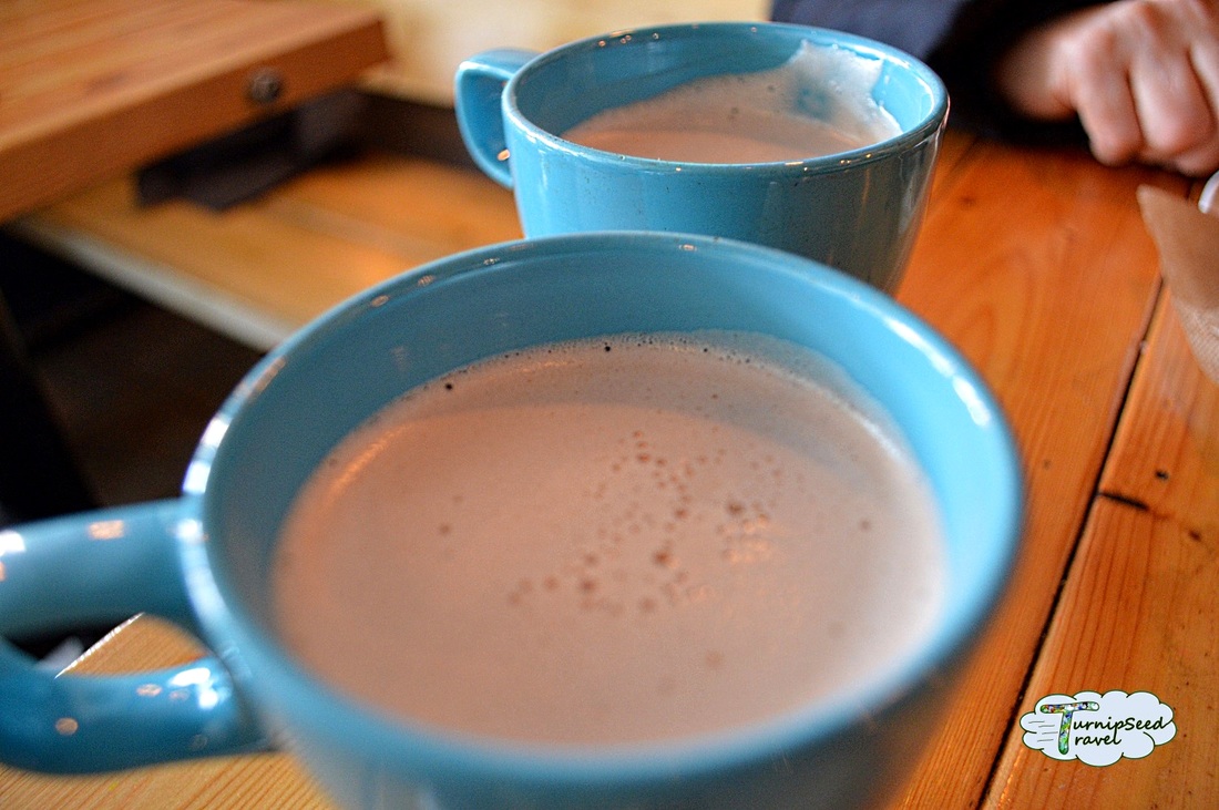 Blue mugs filled with hot chocolate 