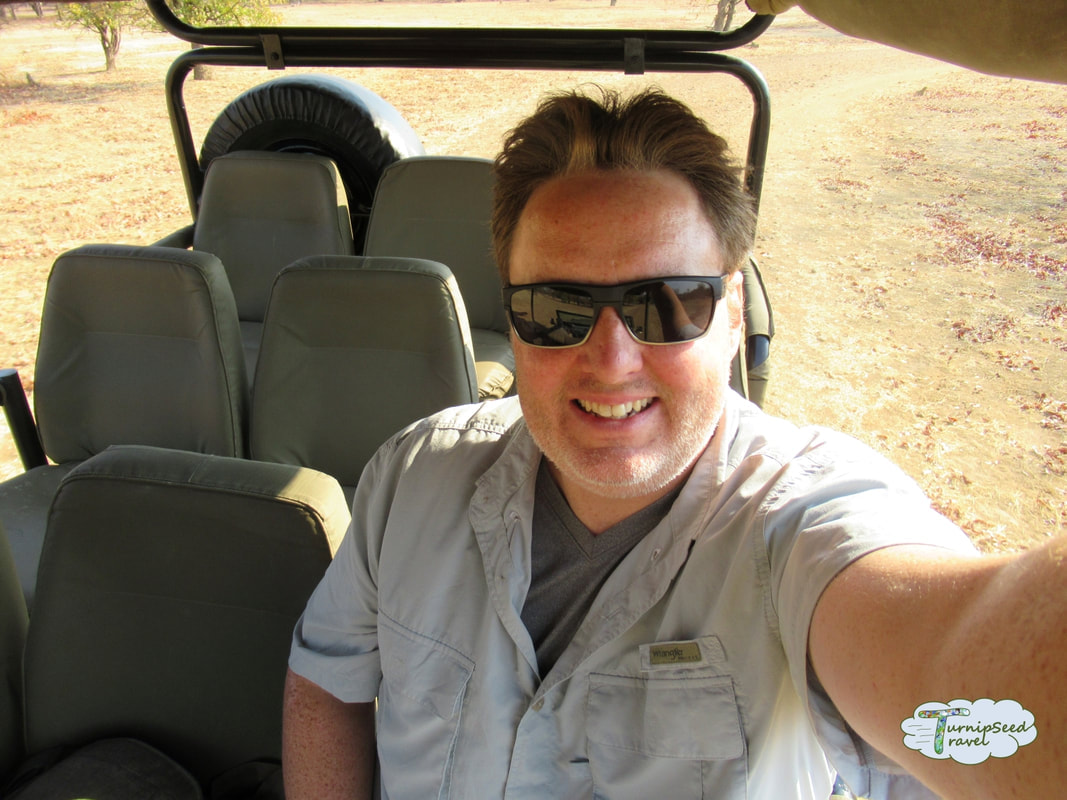 Ryan takes a selfie on the safari truck