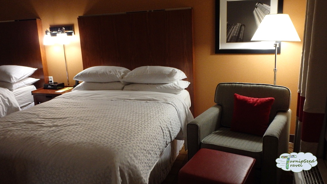 Bed and arm chair Four Points by Sheraton Hotel Calgary Airport