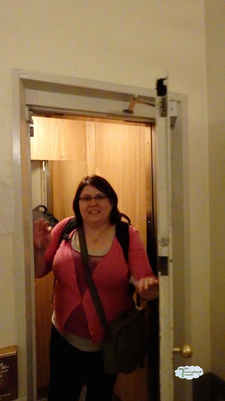Vanessa in a pink sweater entering the hostel room Picture