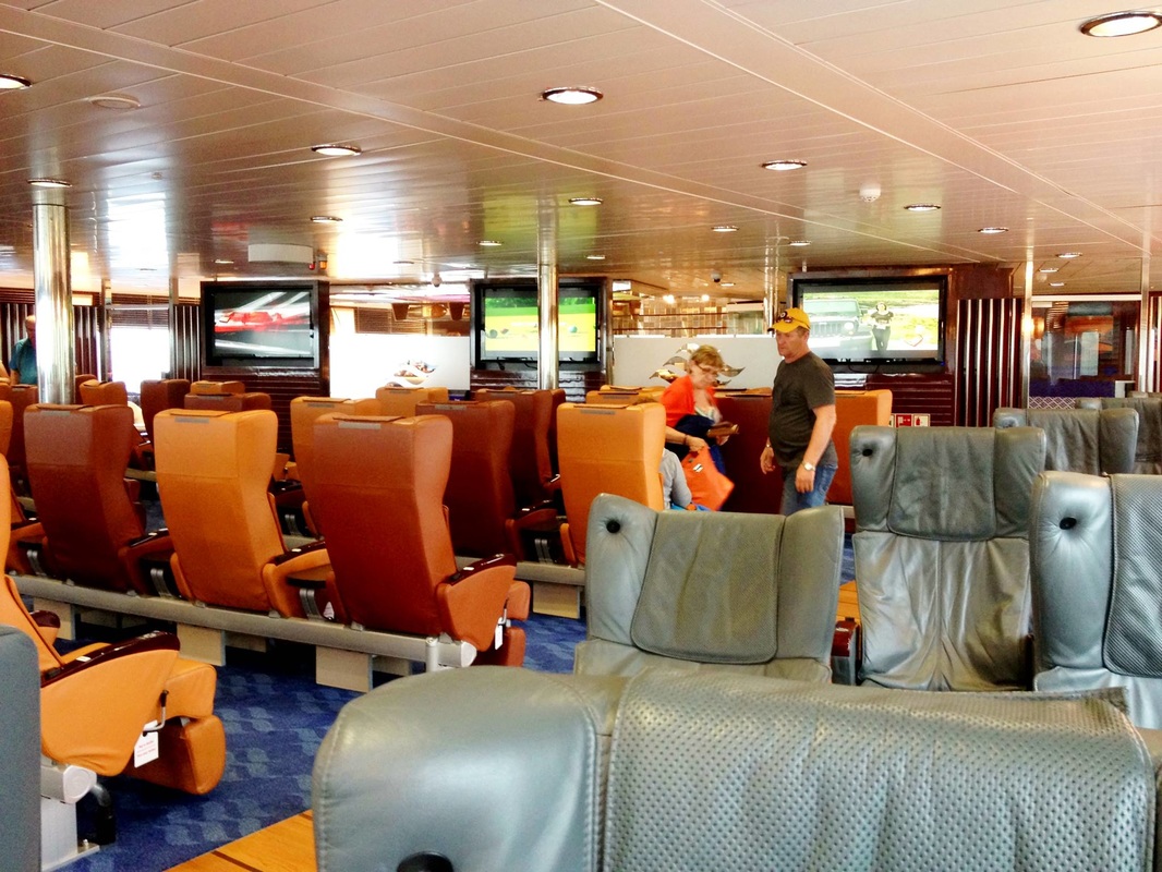 Interior orange and grey seats in the ferry's entertainment area
