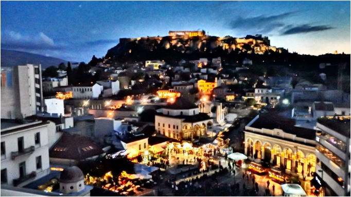 Travel to Athens: The Acropolis and Monastiraki Market at night. Athens Greece 