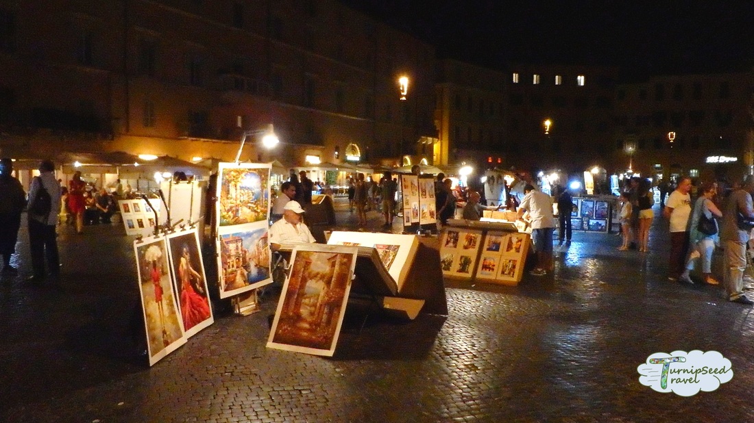 Art vendors at night in a public square Picture