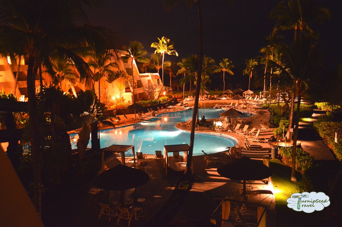 Hotel pool lit up at night Picture