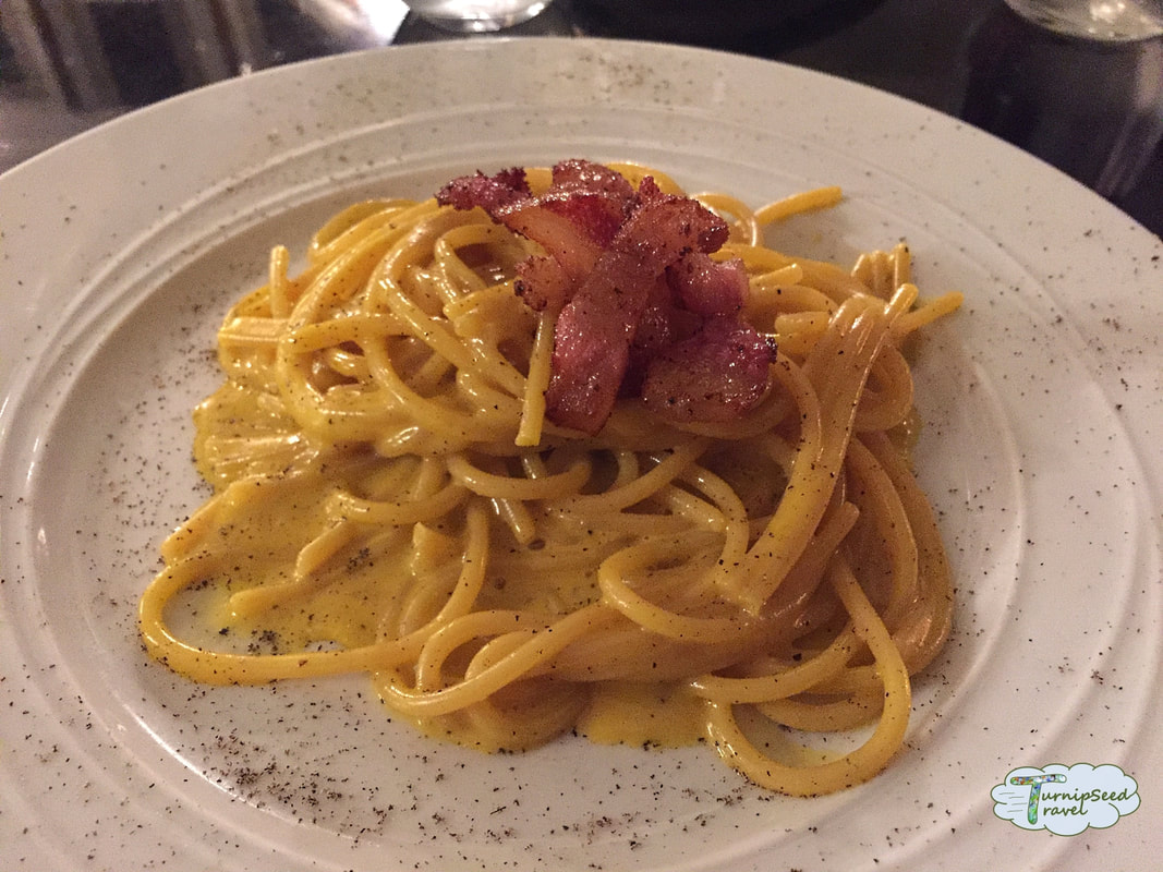 A white plate covered with spaghetti carbonara Picture