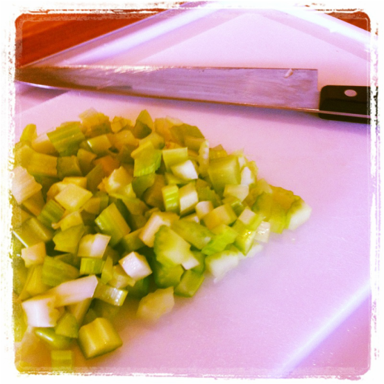 Cutting board with chopped celery 