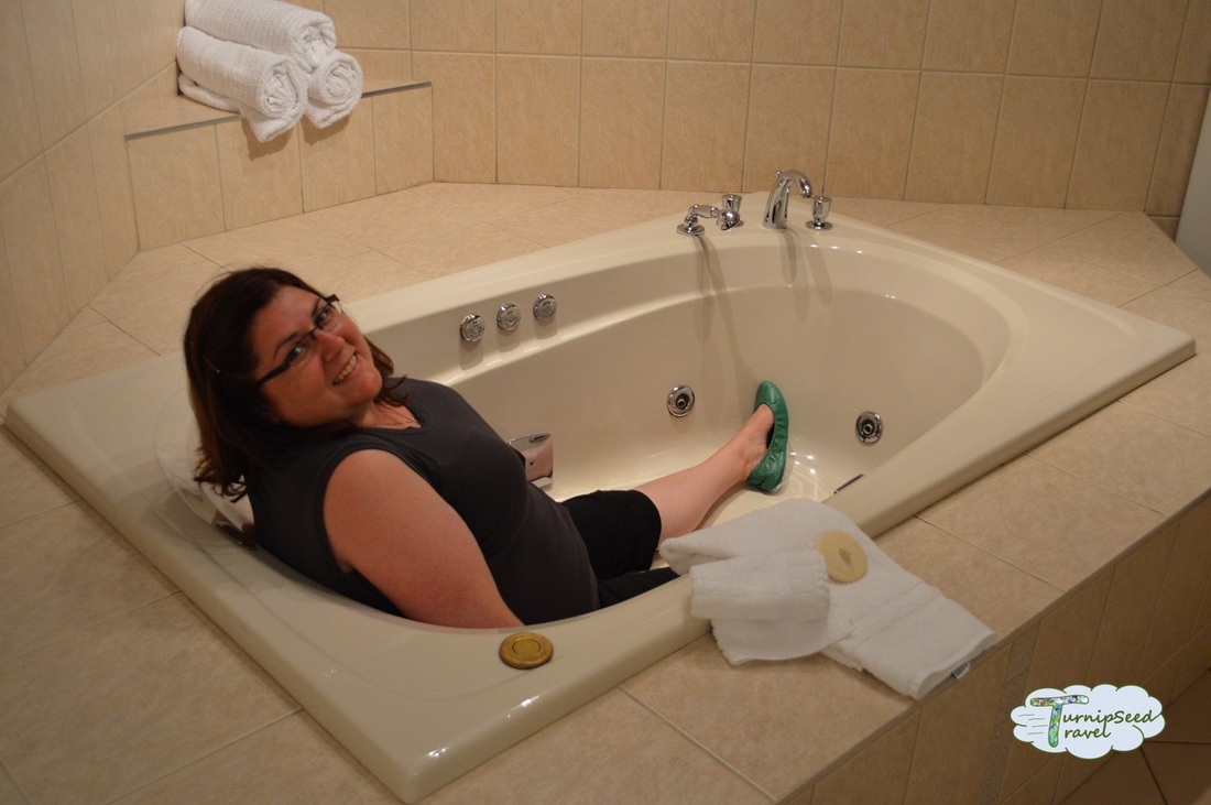 Vanessa sits in a giant bathtub Picture