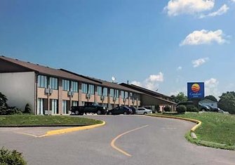 Photo of a two level Comfort Inn hotel and parking lot Picture