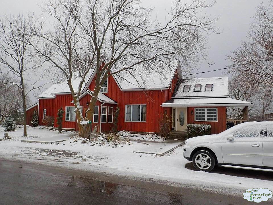 Red farm house in the snow