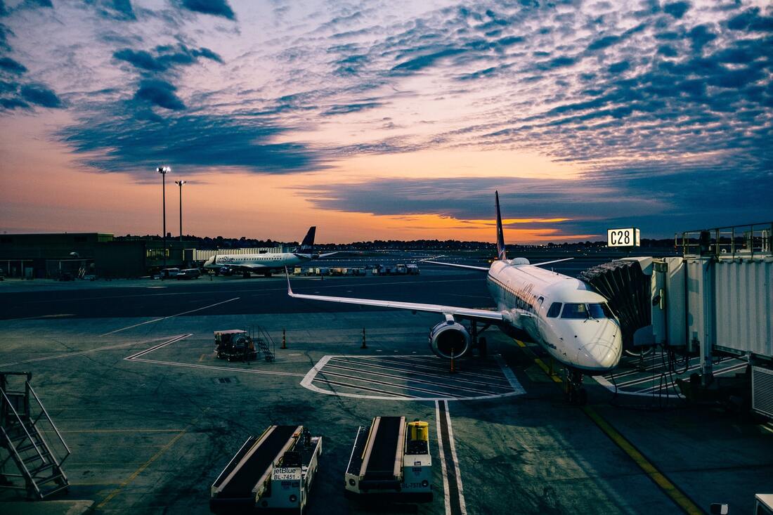 Canadian Transportation Agency Flight Delay Compensation Rules. Airplane and gangway at sunset