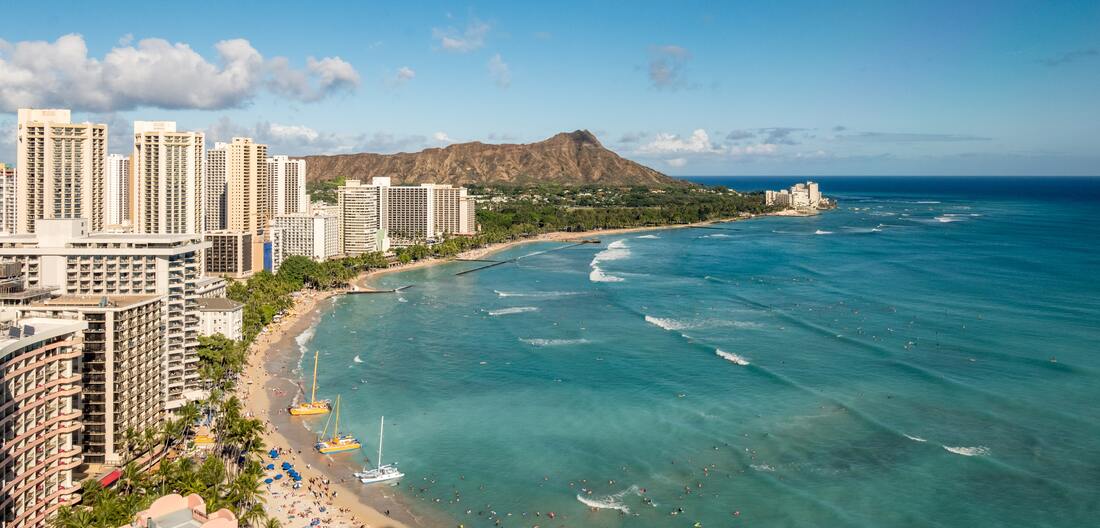 Aerial view of Waikiki beach, hotels, and Diamond Head crater