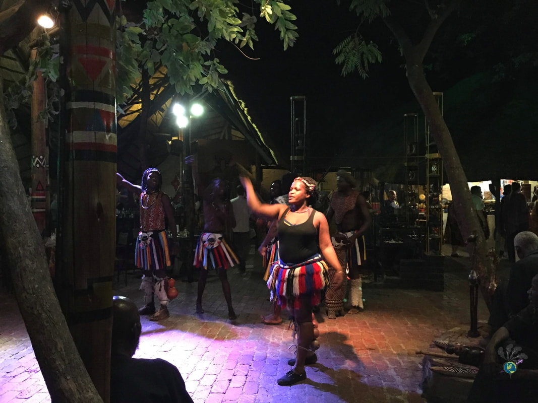 BOMA Victoria Falls buffet and drumming show: Female dancers in dark tank tops and colorful skirts