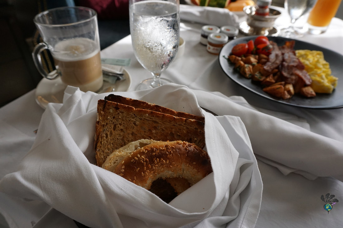 A bread basket with toast and other items on a breakfast room service tray Picture