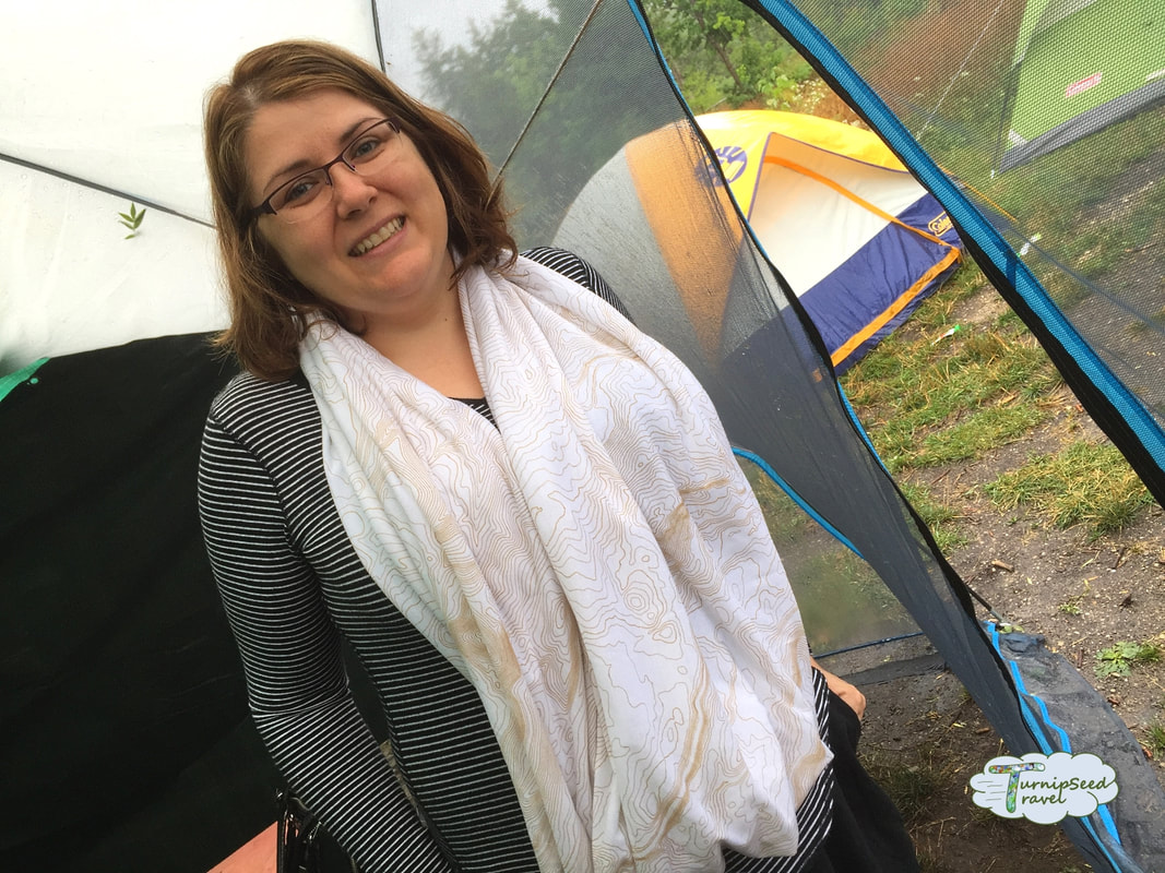 Testing out a scarf with pockets while traveling at Craighleigh Provincial Park: Posing in front of tents Picture