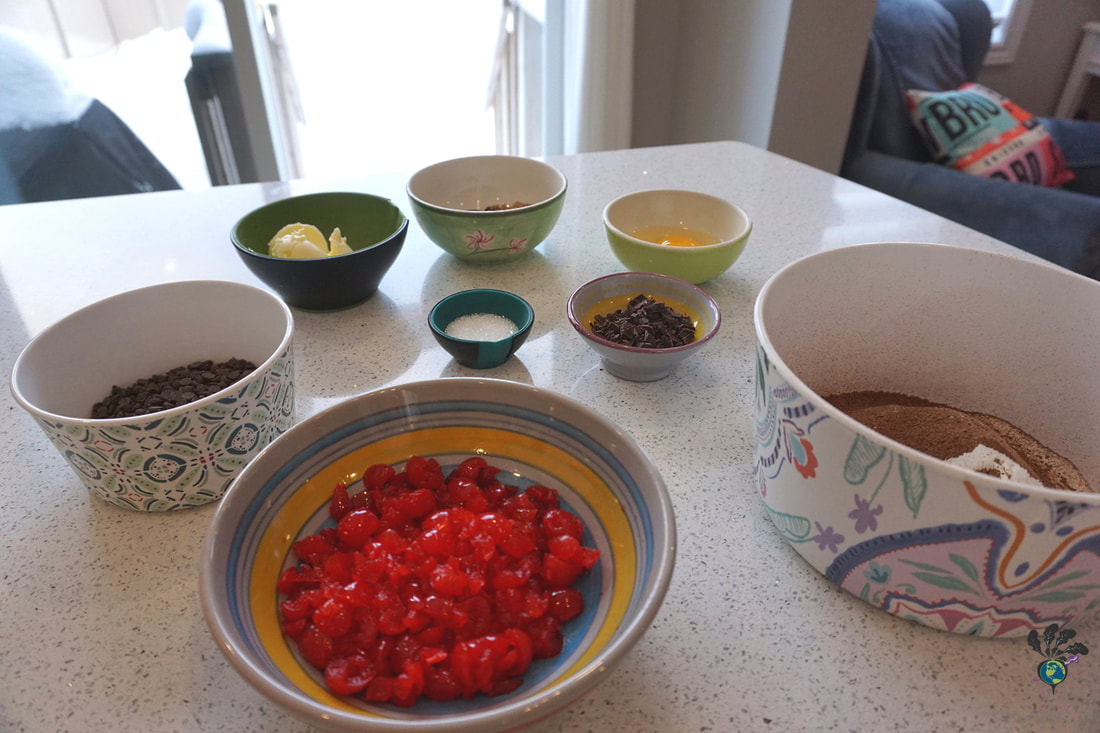 Assorted colourful bowls of ingredients for Black Forest cookiesPicture