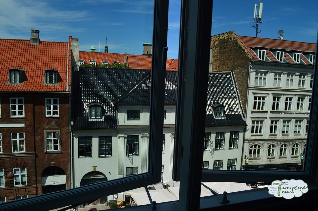 View of Danish houses from a partially opened window in Copenhagen