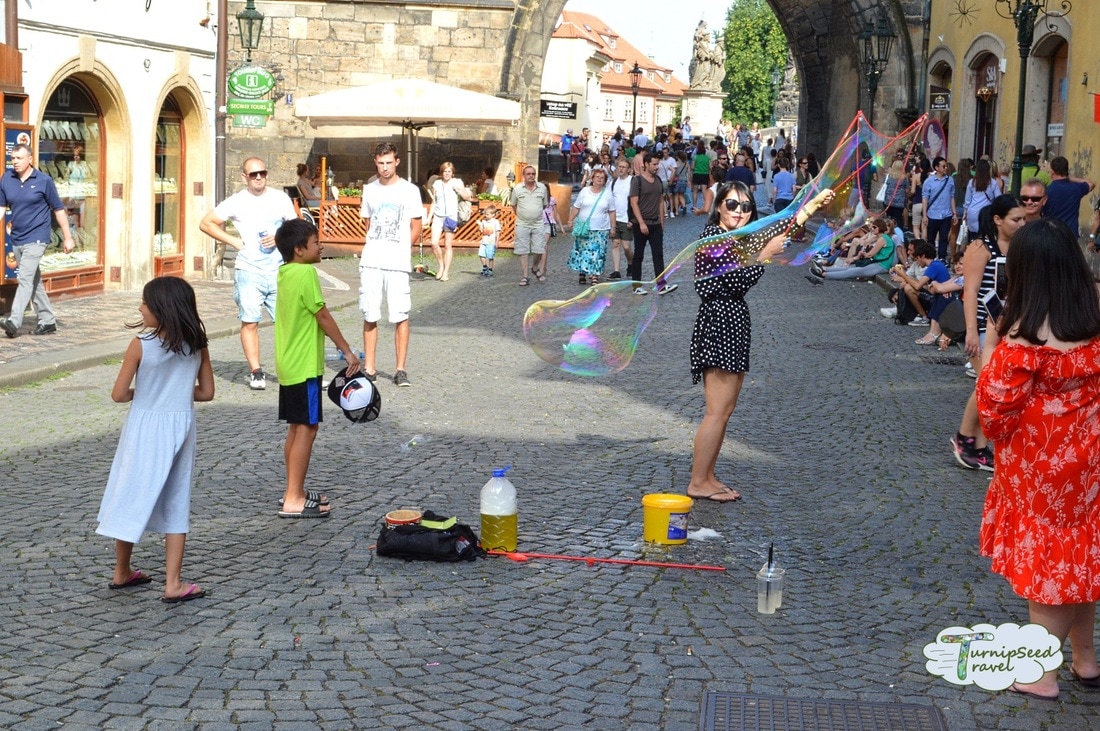Street buskers and soap bubbles at Charles Bridge. Picture