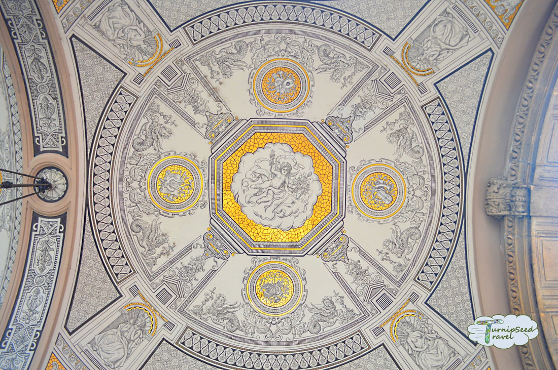 Black white and gold ceiling mural seen while touring the Hungarian state opera house.