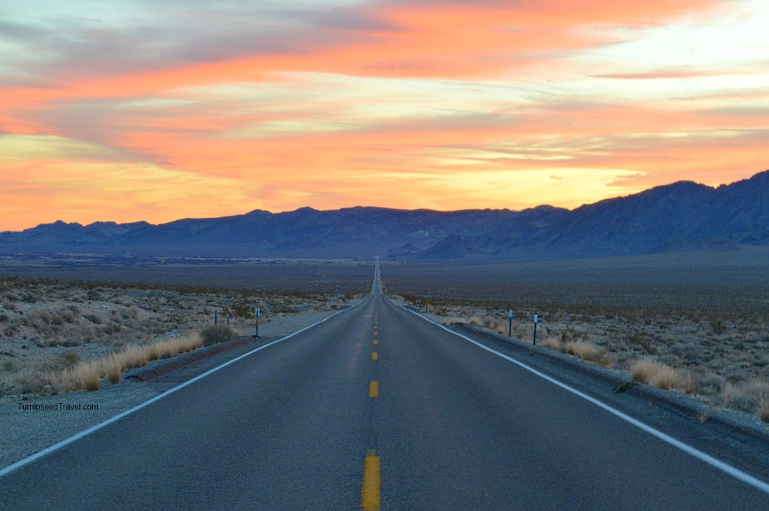 Death Valley national park road at sunset.